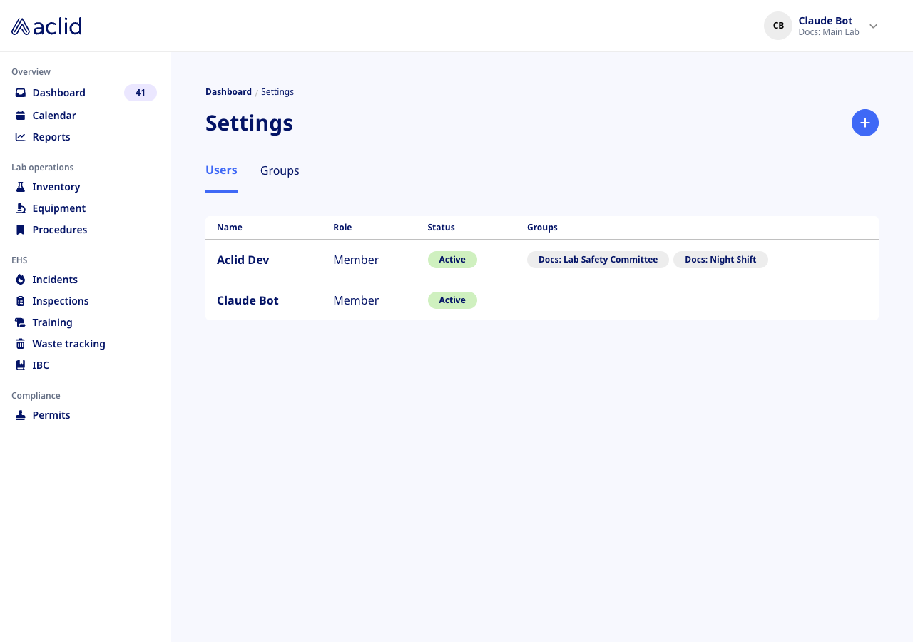 Settings page on the Users tab, listing two users with role, status and groups