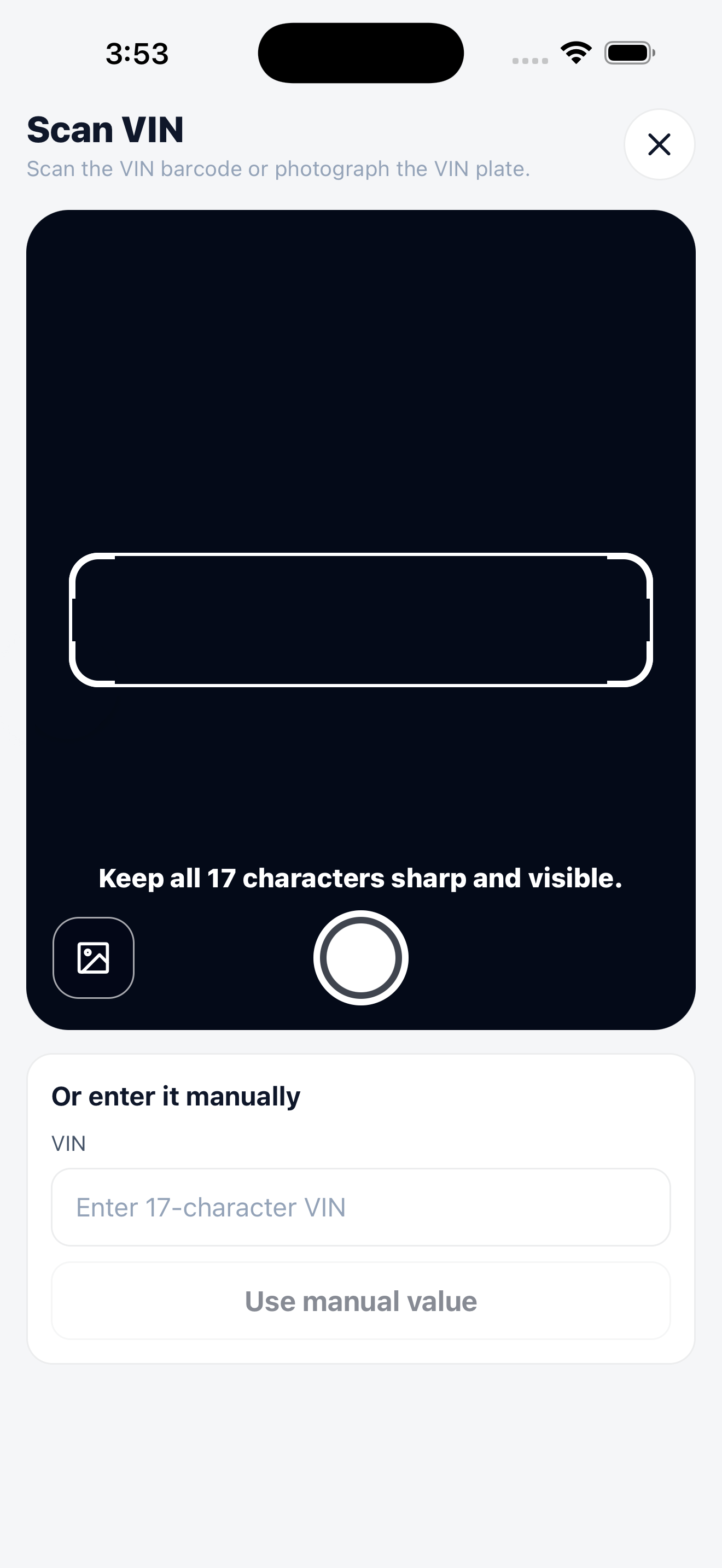 The VIN scanner with a camera frame, the guidance to keep all 17 characters sharp and visible, a photo upload button, and a manual entry field underneath.