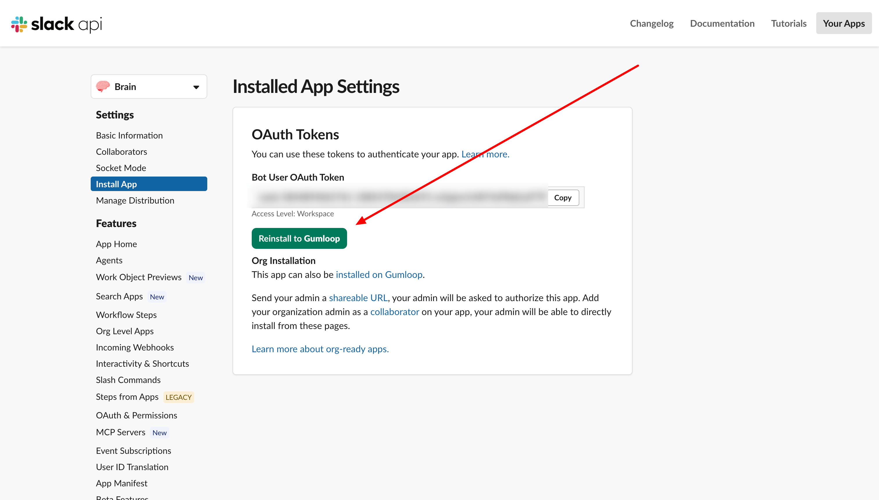 Slack Install App settings showing the Bot User OAuth Token and the Reinstall to Workspace button