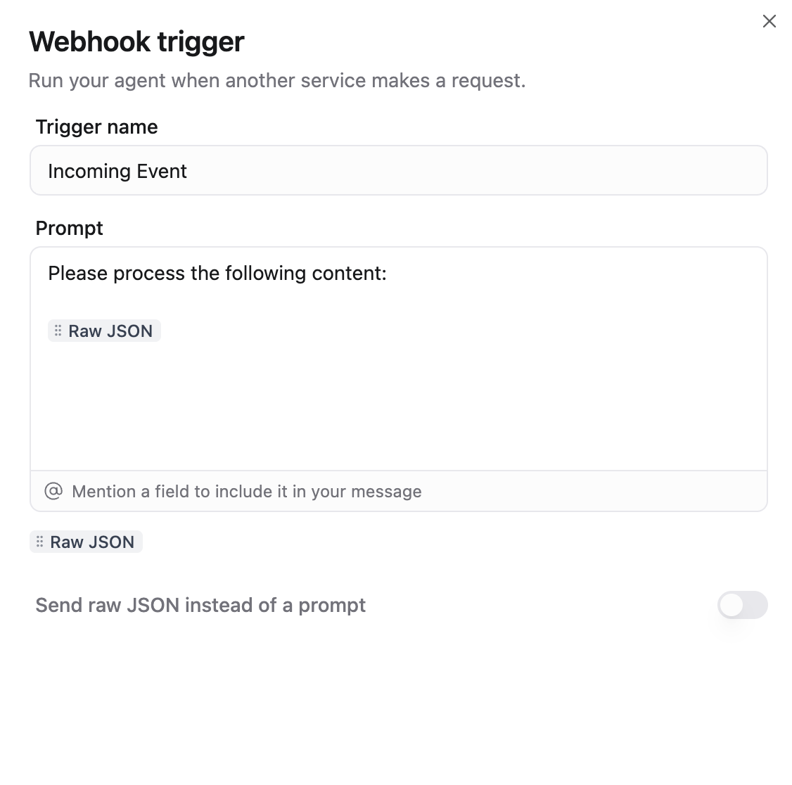 Webhook trigger dialog with Trigger name, a prompt containing the Raw JSON badge, and the Send raw JSON instead of a prompt toggle