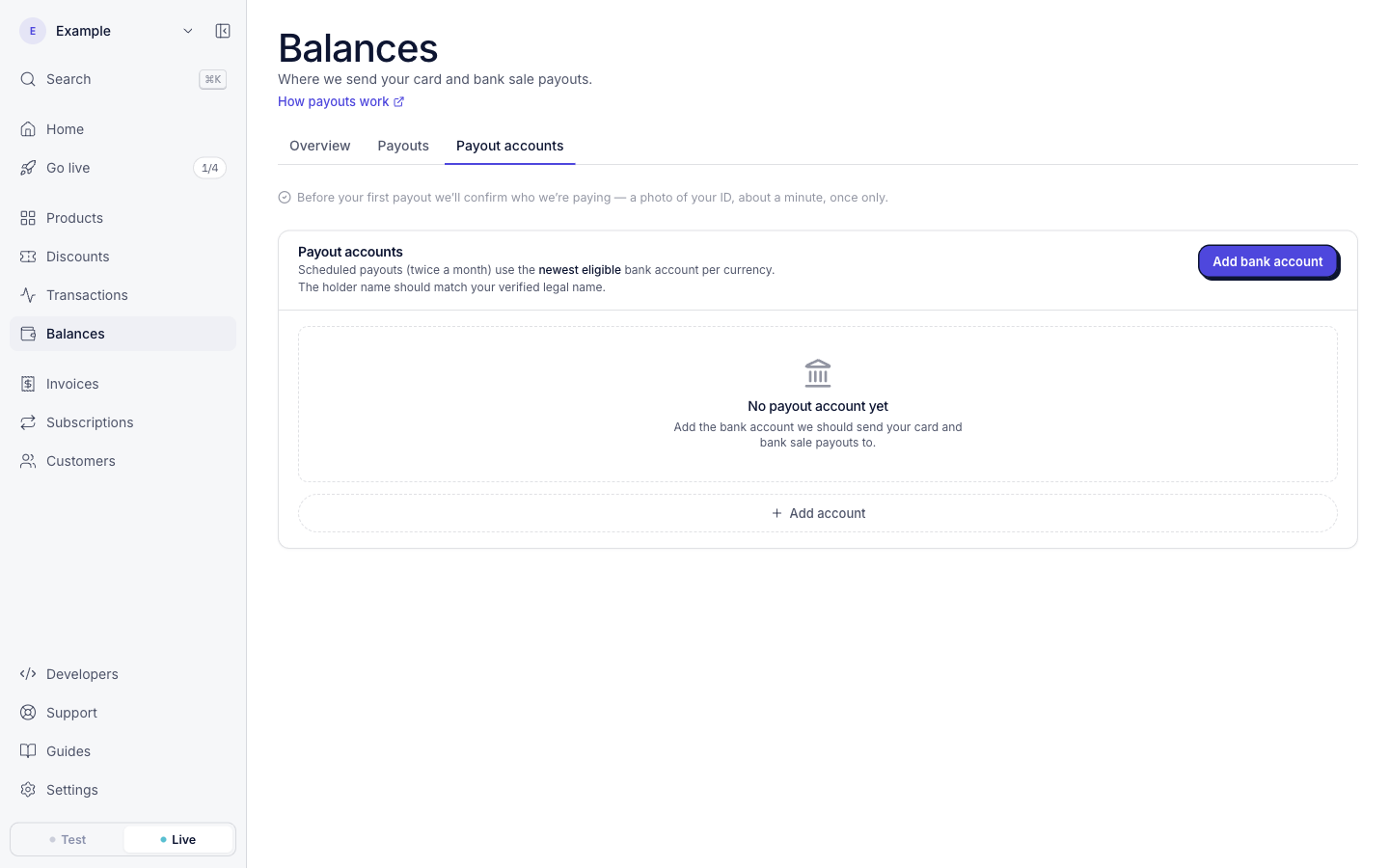 The Balances page, Payout accounts tab, in live mode. Above the payout accounts, a note says: Before your first payout we’ll confirm who we’re paying, a photo of your ID, about a minute, once only.