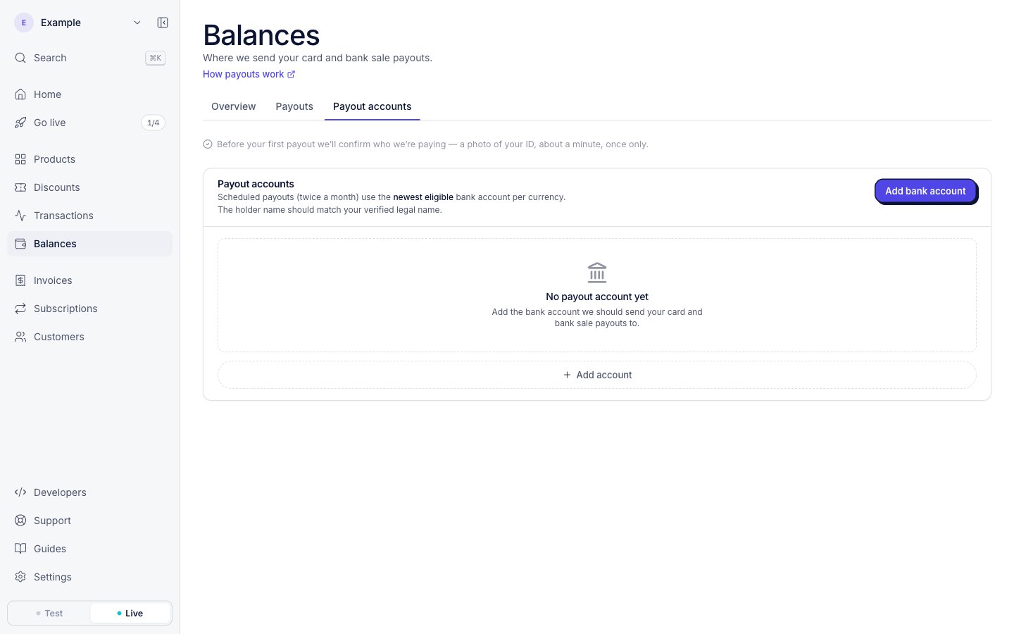 The Balances page, Payout accounts tab, in live mode. Above the payout accounts, a note says: Before your first payout we’ll confirm who we’re paying, a photo of your ID, about a minute, once only.