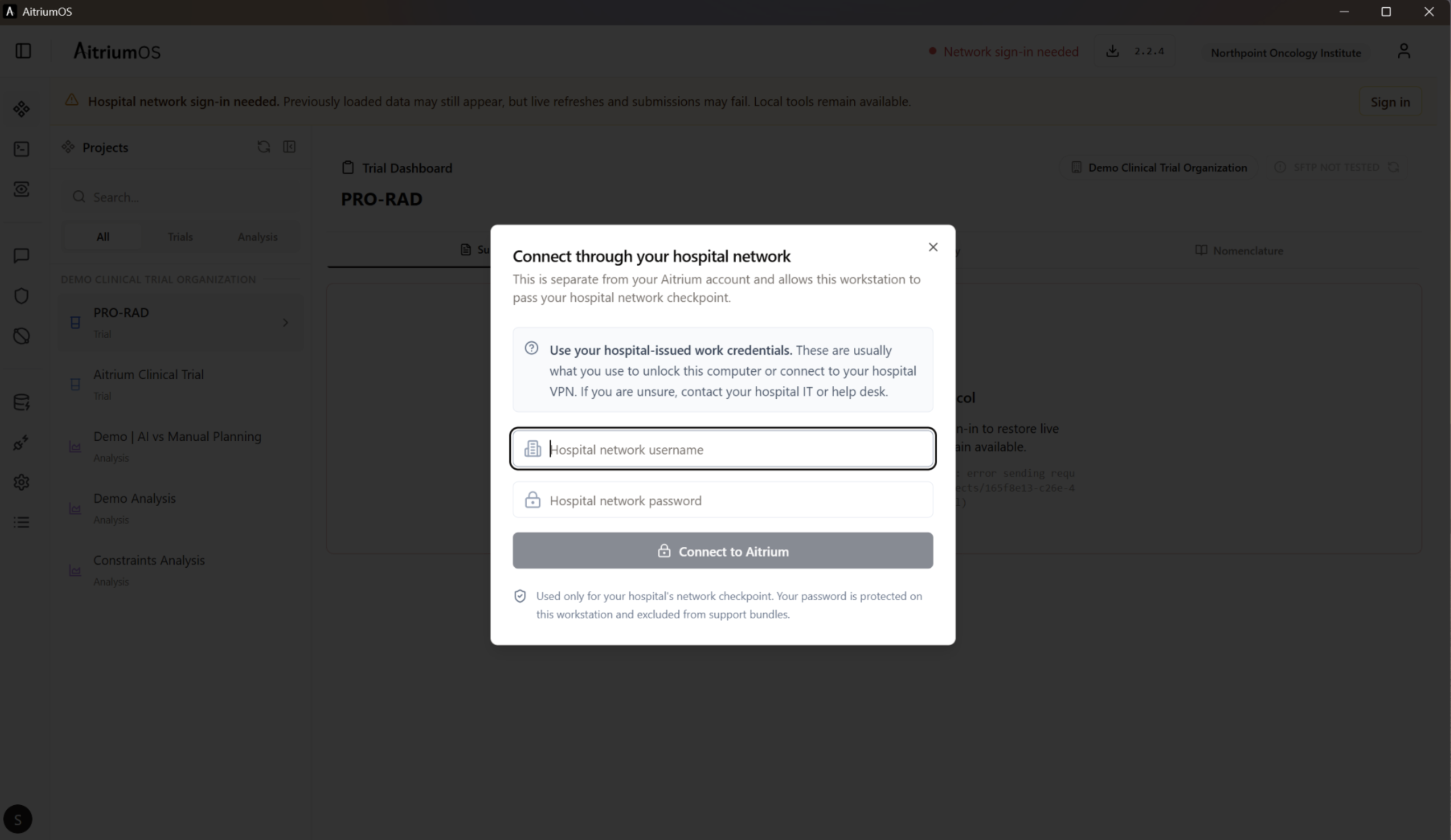 Hospital-network sign-in dialog displayed over the current trial dashboard