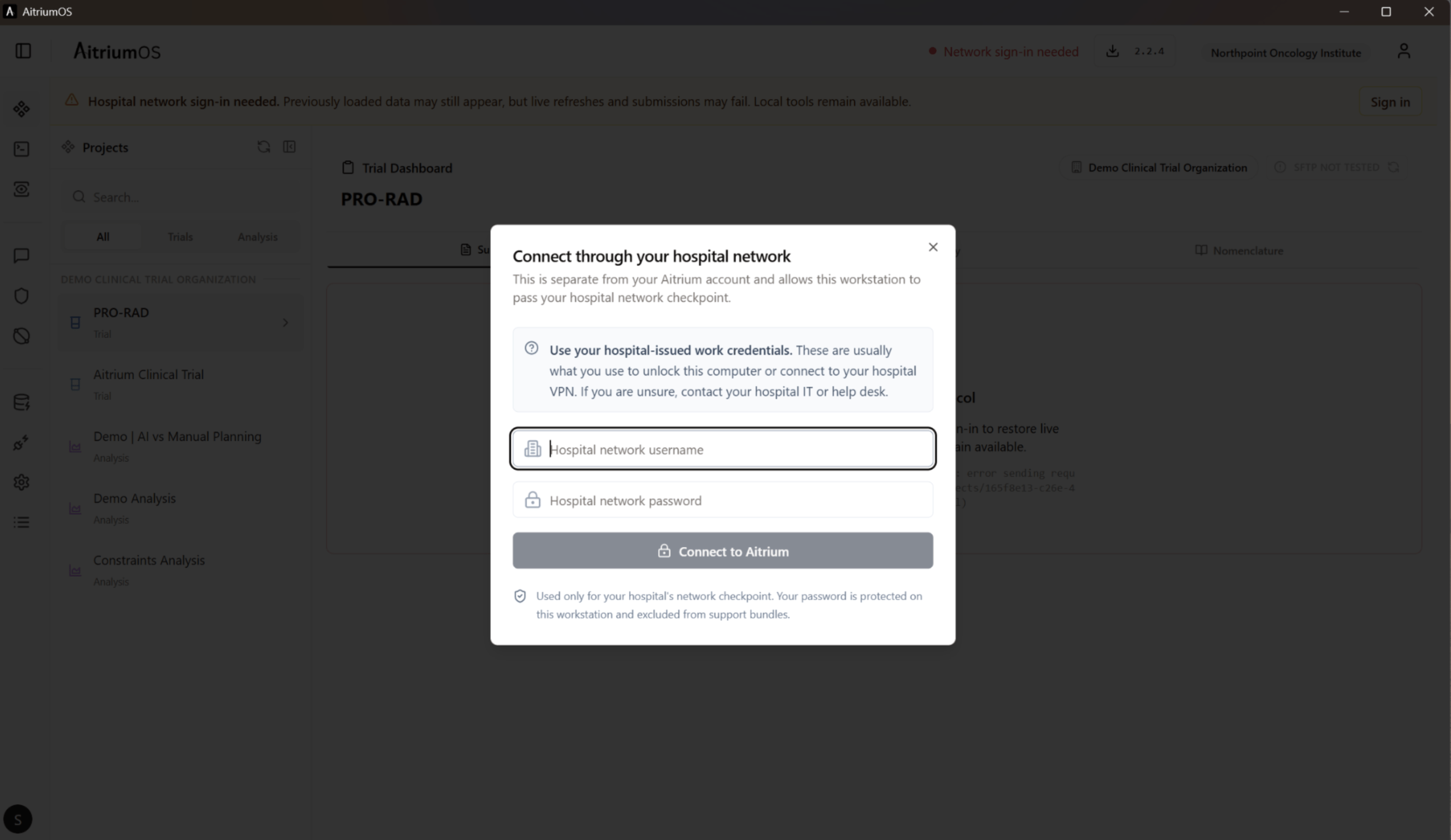 Hospital-network sign-in dialog displayed over the current trial dashboard