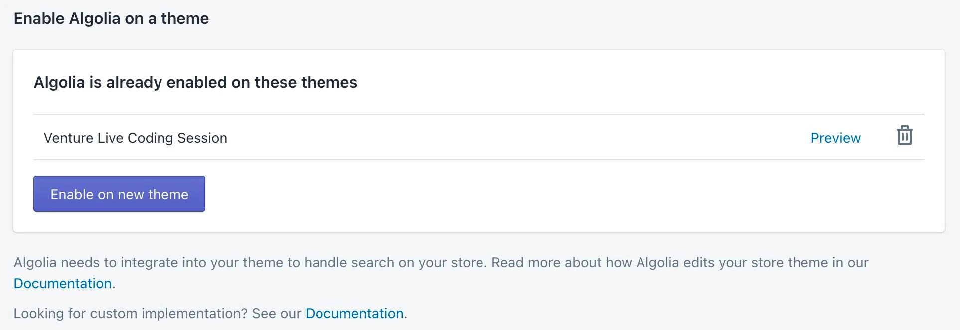 Screenshot of a section titled 'Enable Algolia on a theme' showing a list with 'Venture Live Coding Session' and a blue 'Enable on new theme' button.