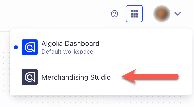 Screenshot of a drop-down menu showing 'Algolia Dashboard' and 'Merchandising Studio' options, with a red arrow pointing to 'Merchandising Studio'.