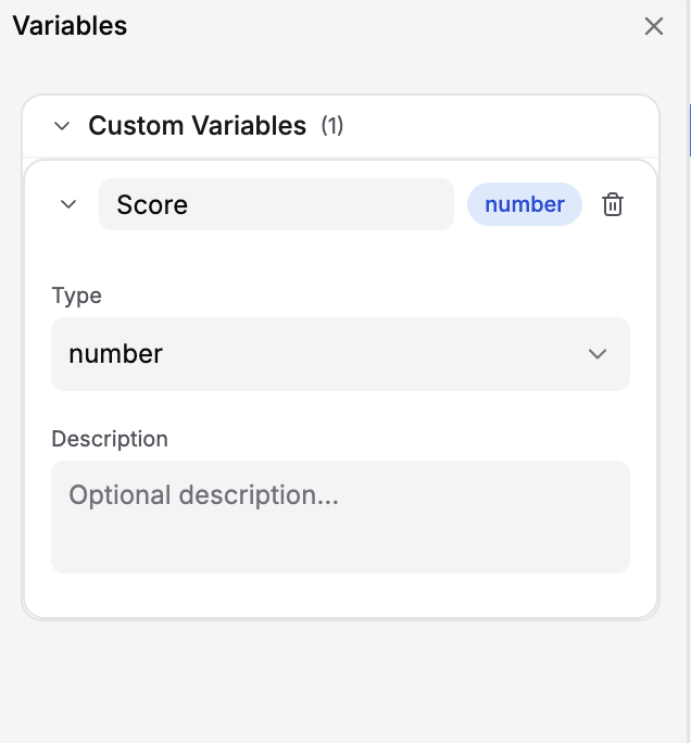 Variables pane showing an expanded Score variable with Type set to number and an empty Description field