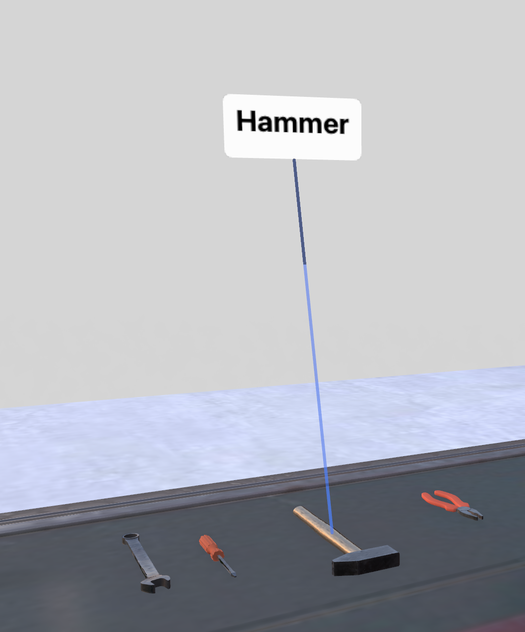 Callout label with leader line pointing to a hammer