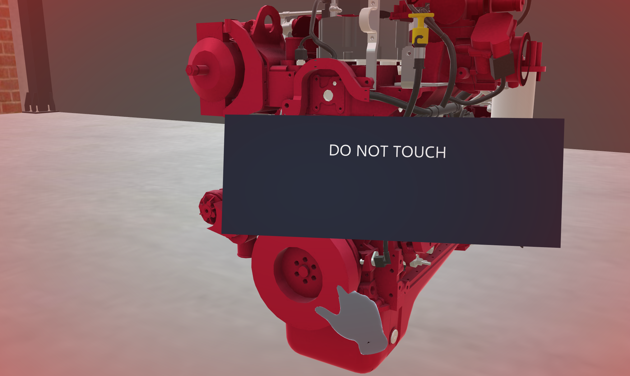 A pause collider message card reading DO NOT TOUCH in front of an engine, with a red tint around the view