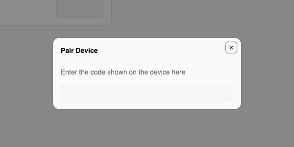 Pair Device dialog with the prompt to enter the code shown on the device and an empty code field
