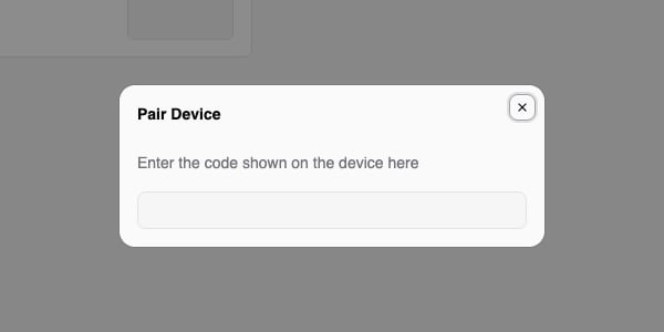 Pair Device dialog with the prompt to enter the code shown on the device and an empty code field