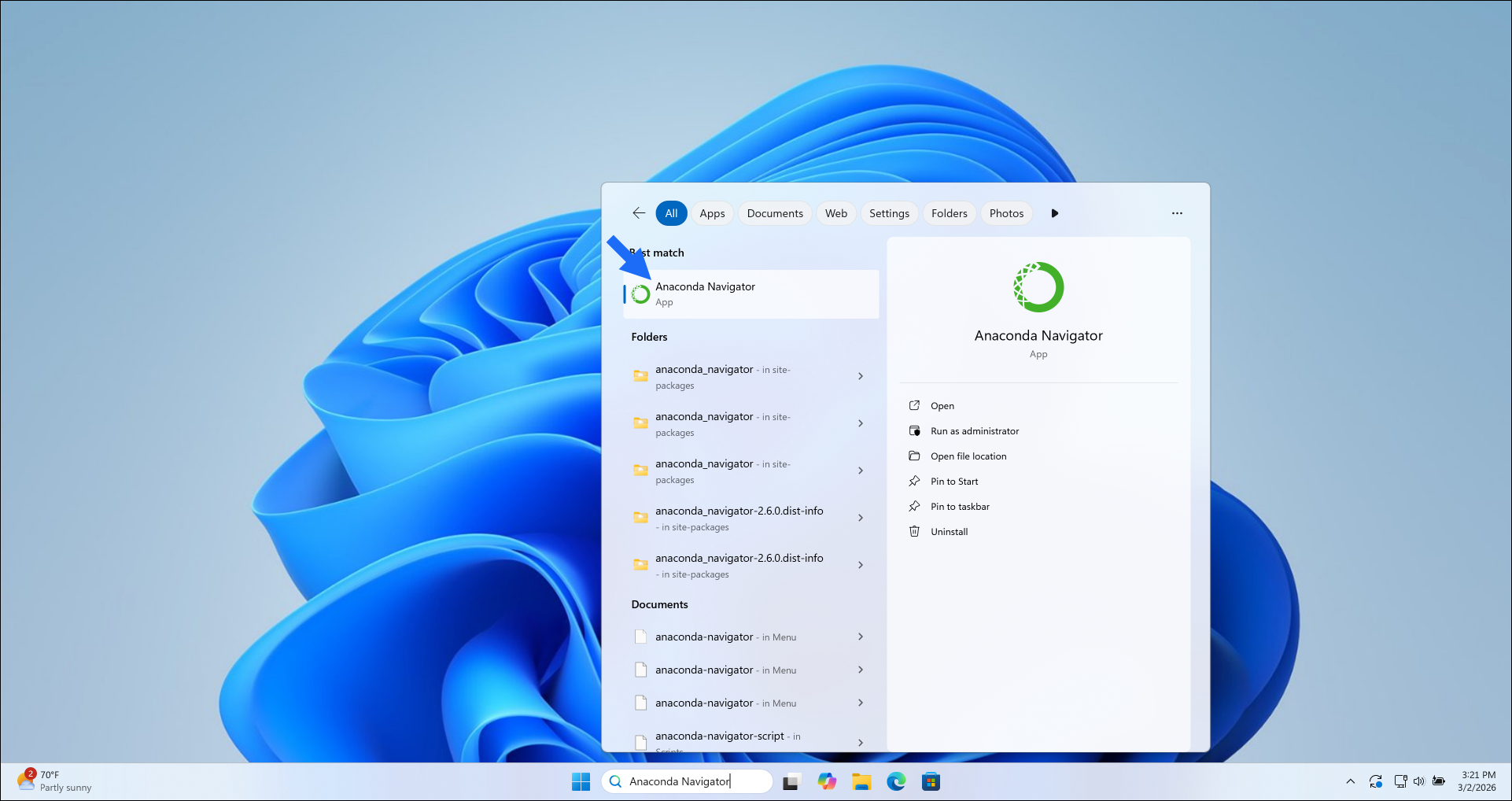 Windows desktop with Anaconda Navigator in the taskbar search field.