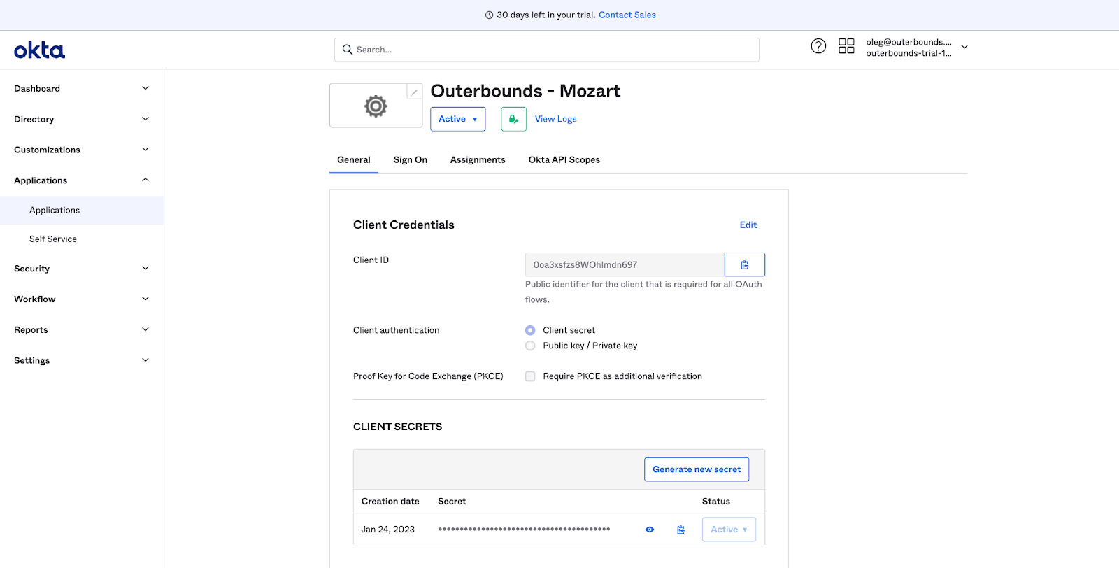 The Okta app integration page showing the Client ID, Client Secret, and Okta domain
