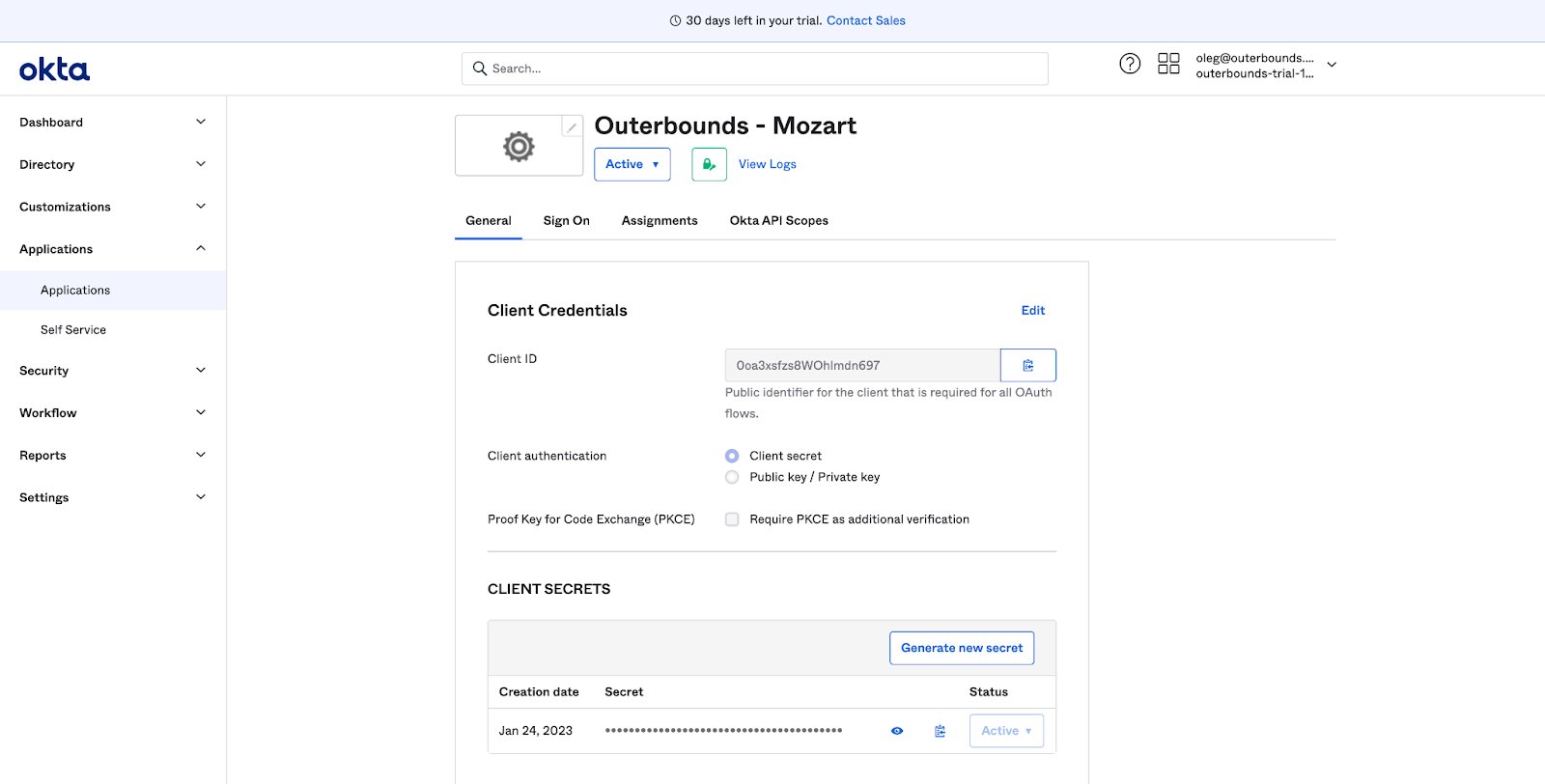 The Okta app integration page showing the Client ID, Client Secret, and Okta domain