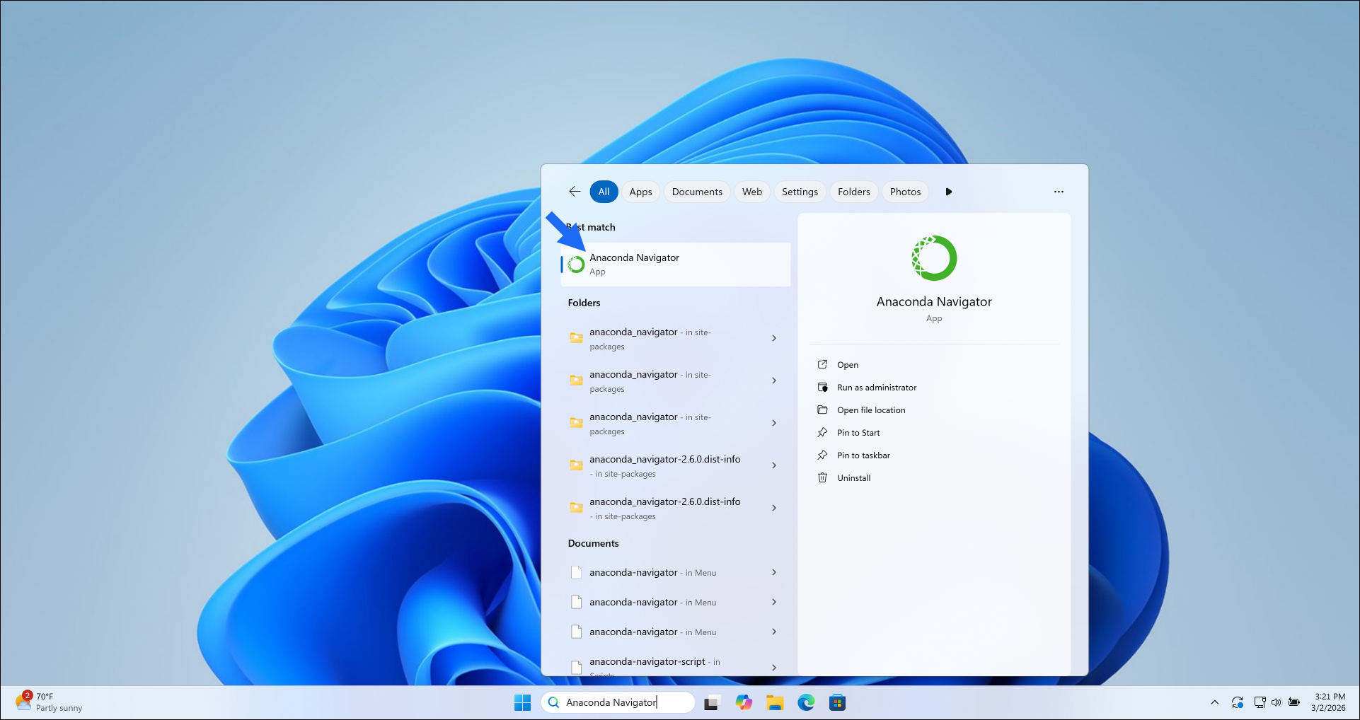 Windows desktop with Anaconda Navigator in the taskbar search field.