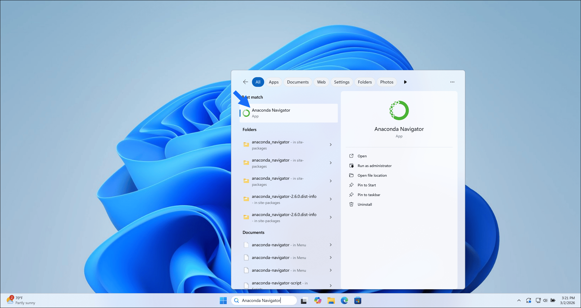 Windows desktop with Anaconda Navigator in the taskbar search field.