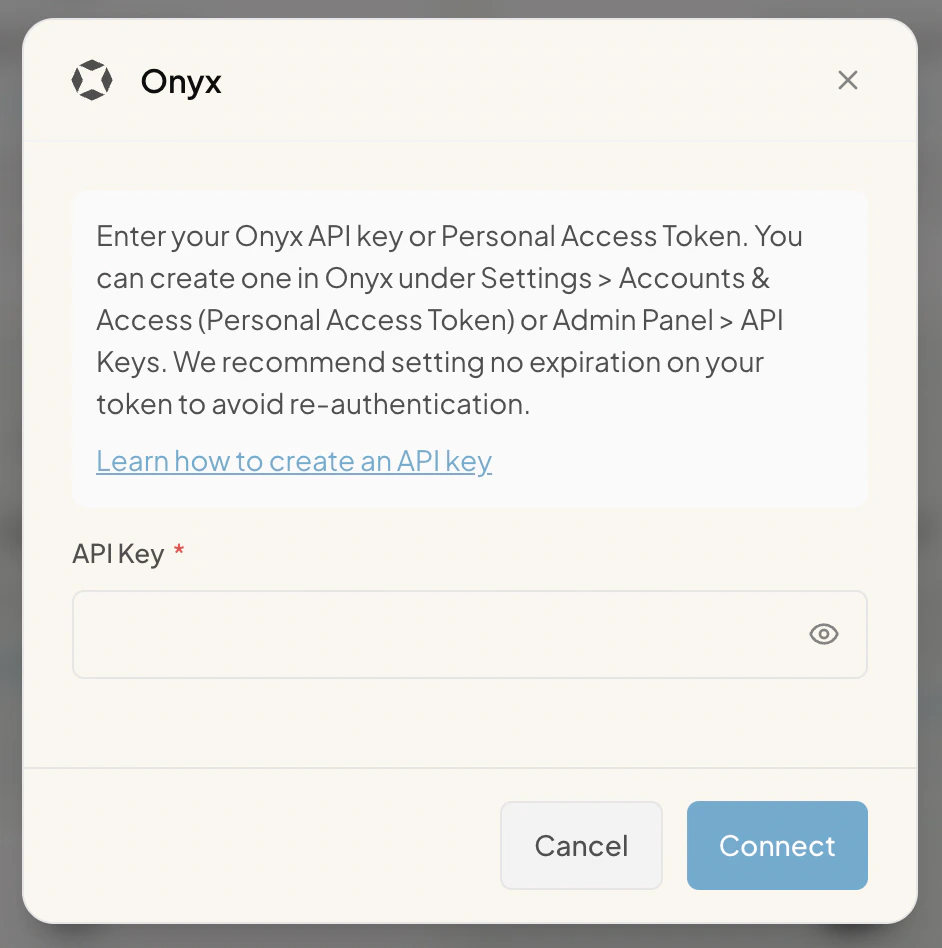 Onyx personal credential modal with explanatory text describing where to generate a Personal Access Token in Onyx, a Learn how to create an API key link, an API Key field, and Cancel and Connect buttons.