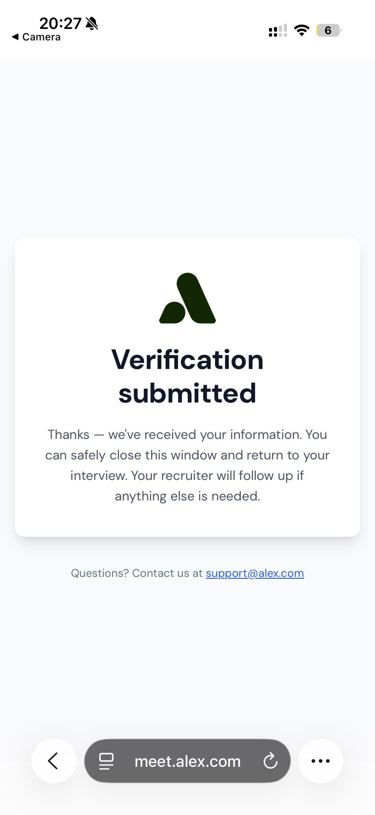 Phone screen confirming the verification was submitted and the candidate can return to their interview