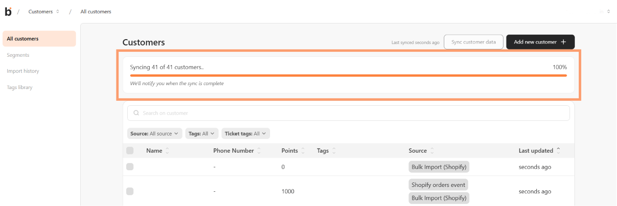 Customers page with a live progress card showing "Syncing 41 of 41 customers.. 100%"