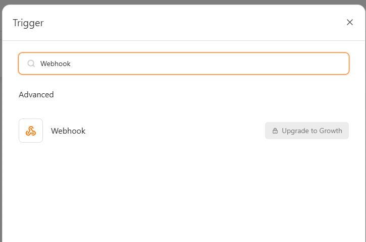 Automation Trigger picker showing Webhook under Advanced with its plan requirement