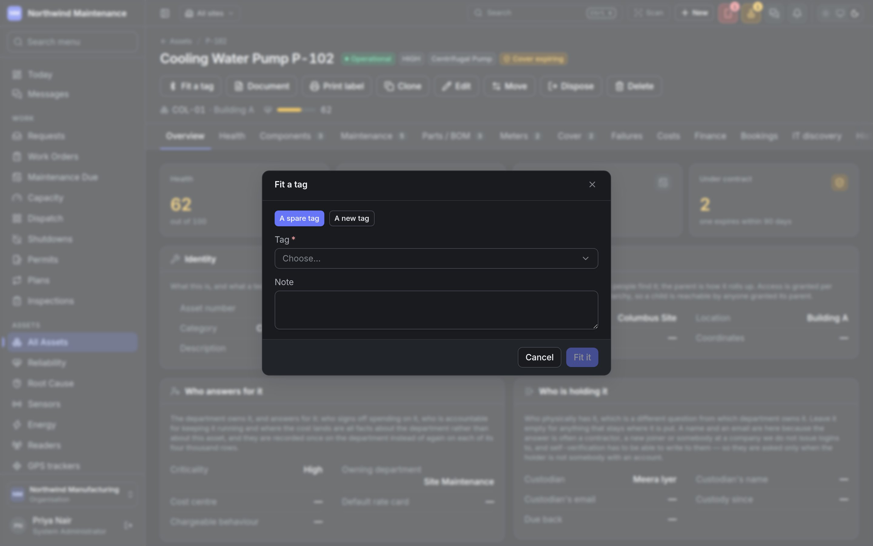 The Fit a tag dialog opened from an asset, offering a spare tag or a new one