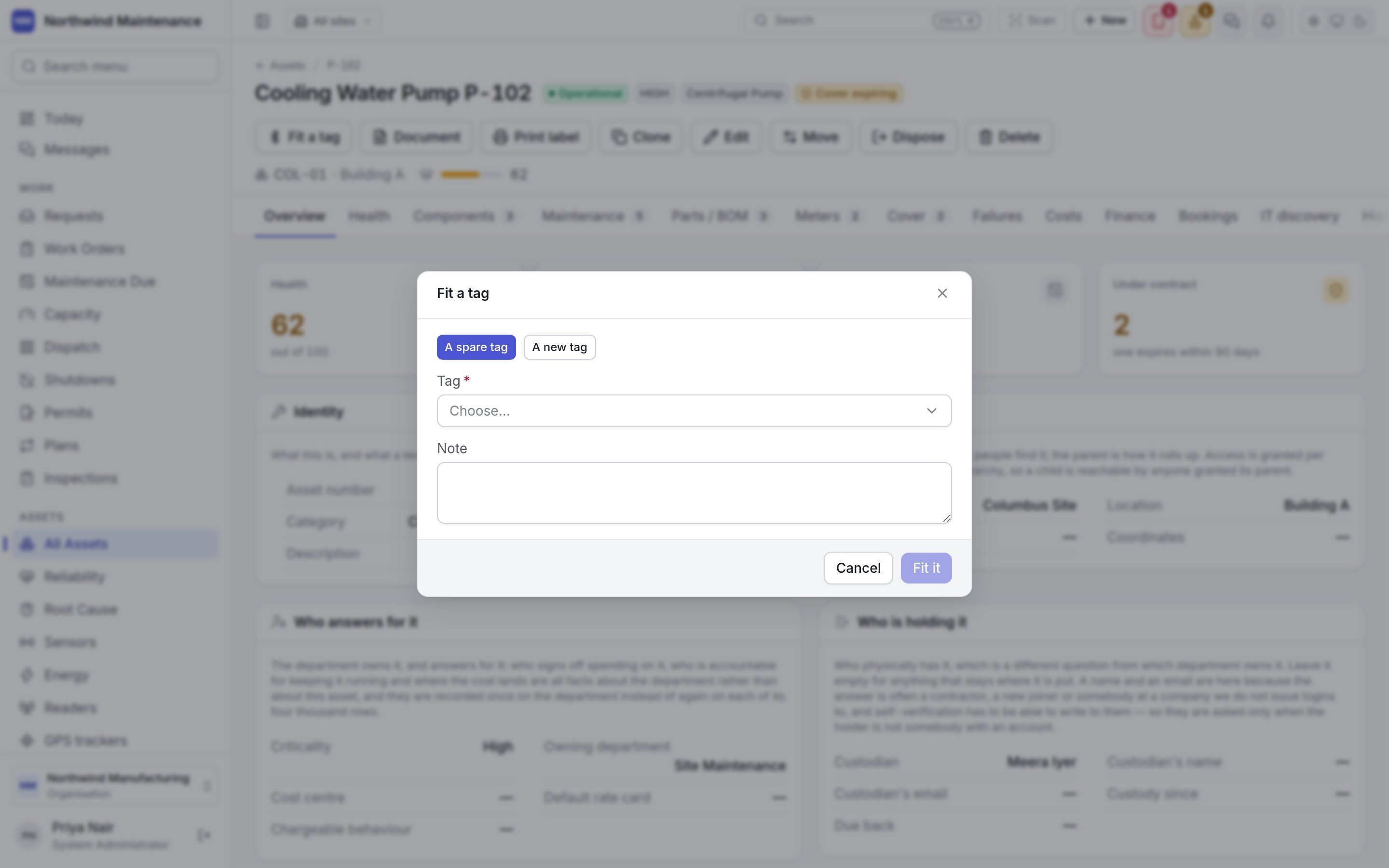 The Fit a tag dialog opened from an asset, offering a spare tag or a new one