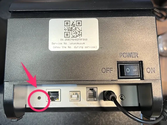 Atlas receipt printer showing small black pairing button location at the back of the device