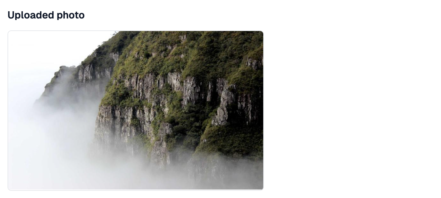 An Uploaded photo heading with a photo of a misty cliff under it, kept to a medium height