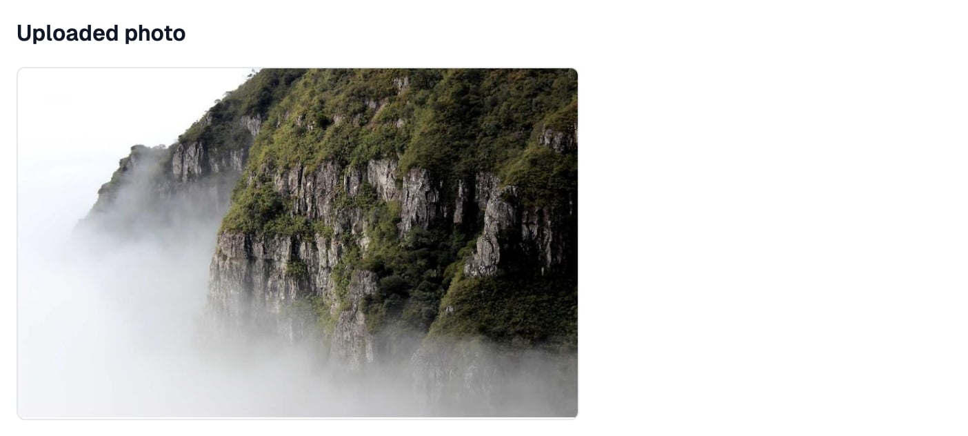 An Uploaded photo heading with a photo of a misty cliff under it, kept to a medium height