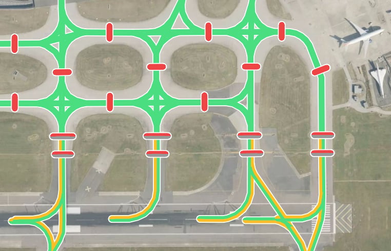 Division lighting data overlaid on a satellite map of London Heathrow Airport, showing taxiway lighting and stop bars