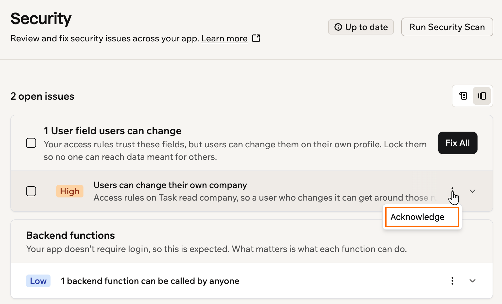 A screenshot of a security issue's More actions menu open, with Acknowledge outlined