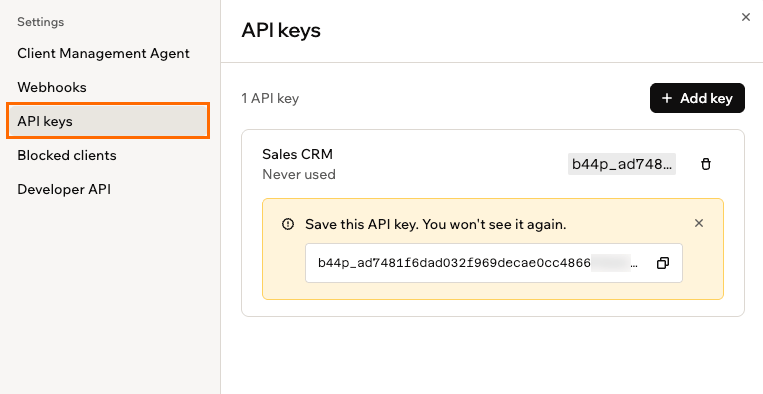 新しいキーと保存のリマインダーを示す API keys 設定タブ