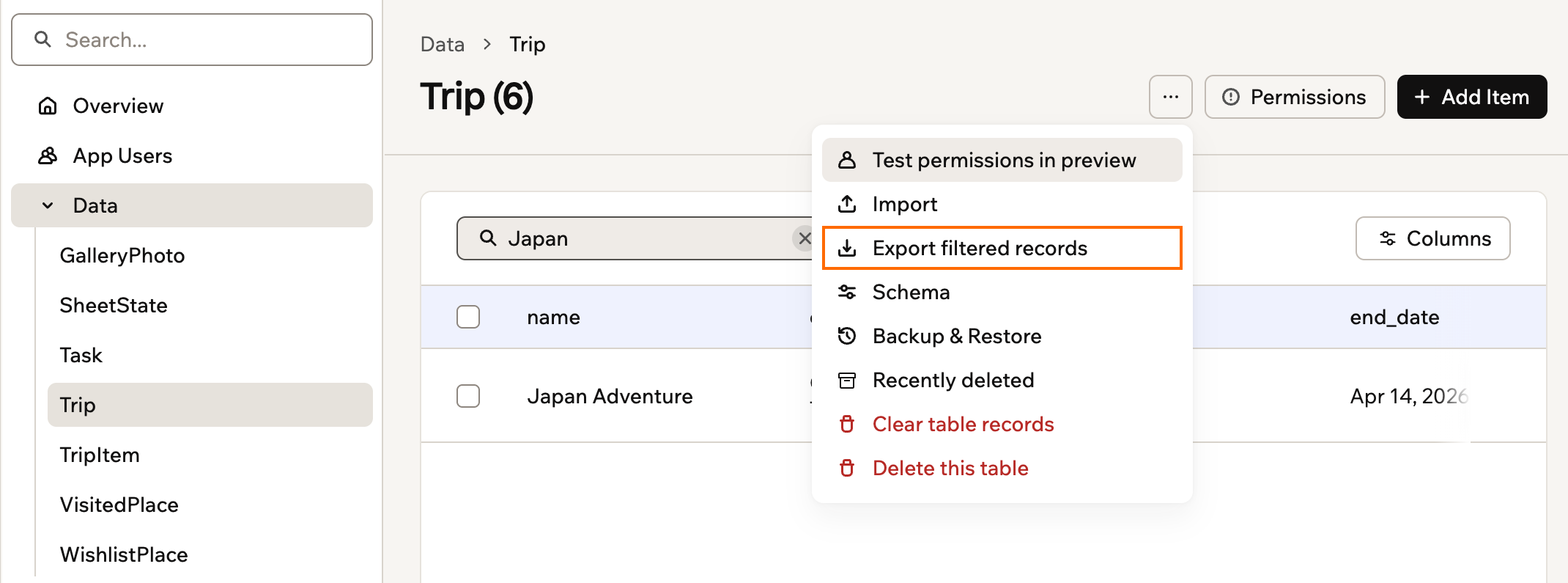 A searched Trip table with its More actions menu open and Export filtered records outlined