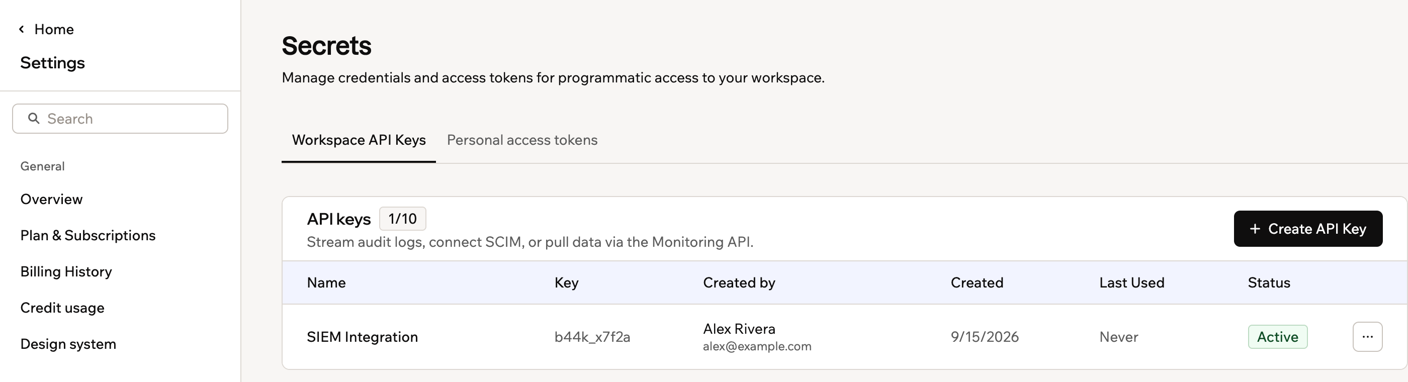 A screenshot of the Secrets page listing a workspace API key and its status