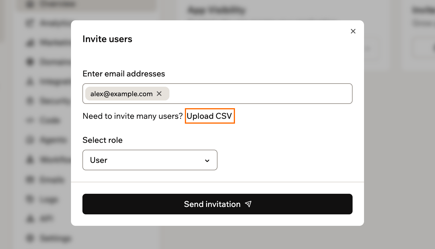 A screenshot of the Invite users window with an email address entered and Upload CSV highlighted