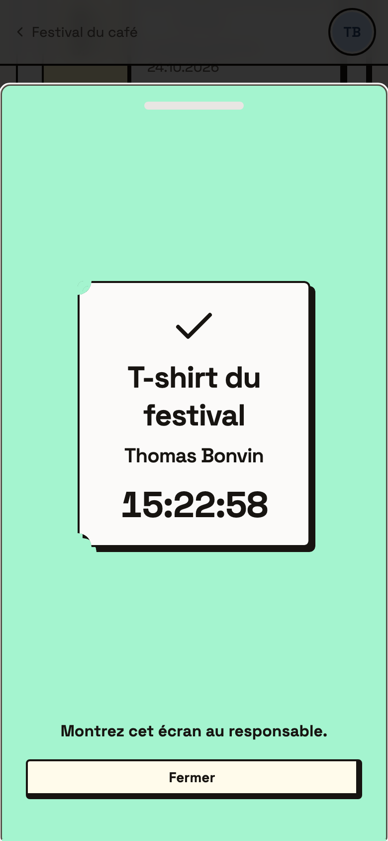 L'écran vert de la remise du t-shirt, avec le nom du bénévole et l'heure