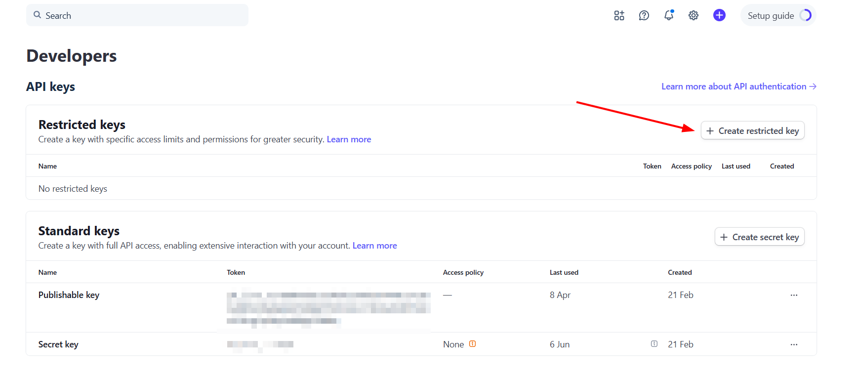 Stripe Dashboard API keys page with the Create restricted key button