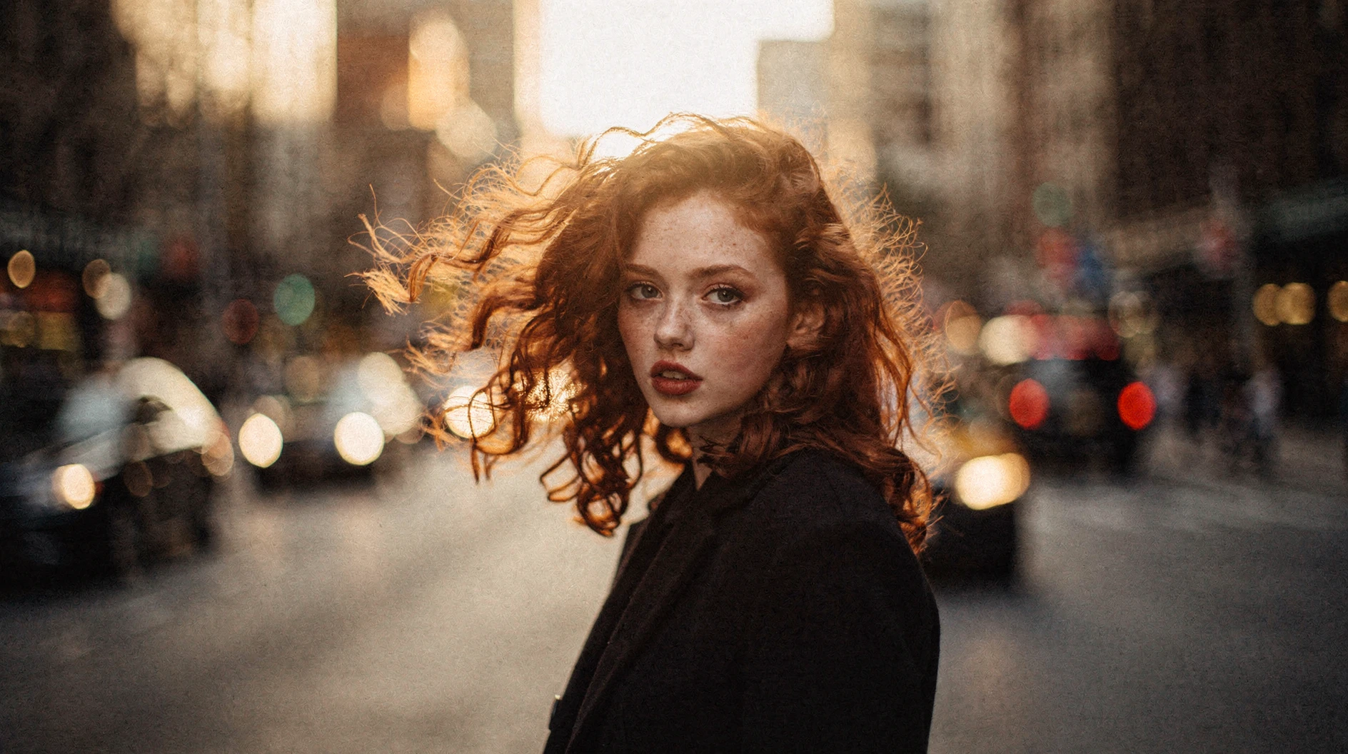 Final portrait with warm tones, film grain, and wind-blown hair