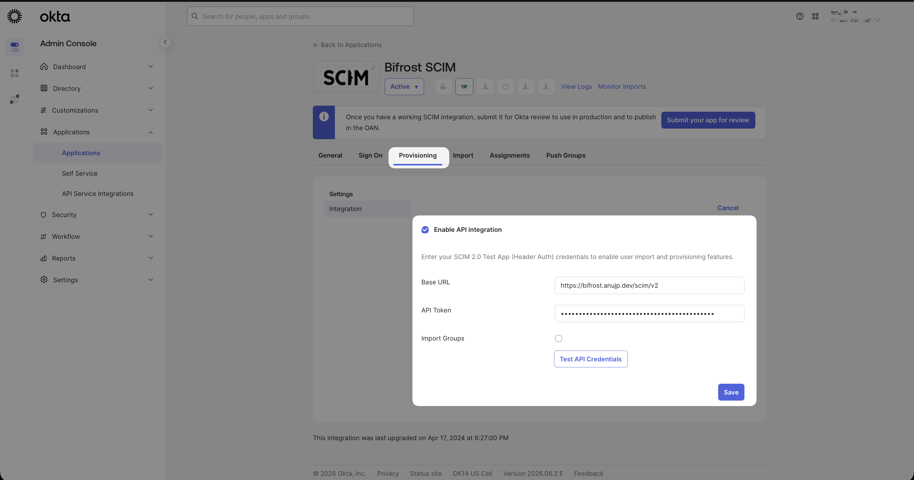 Okta SCIM app Configure API Integration dialog with Base URL and API Token fields filled in