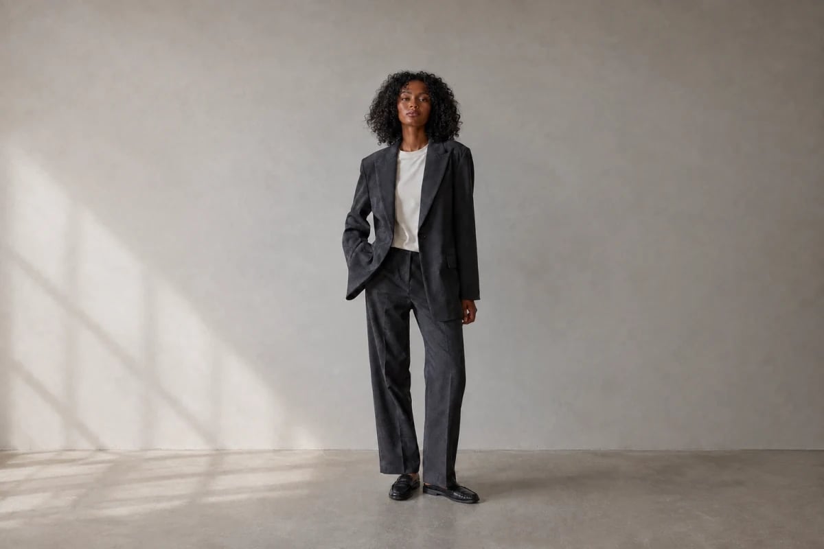 Extended composition of the gray-suit fashion photo with more space around the subject