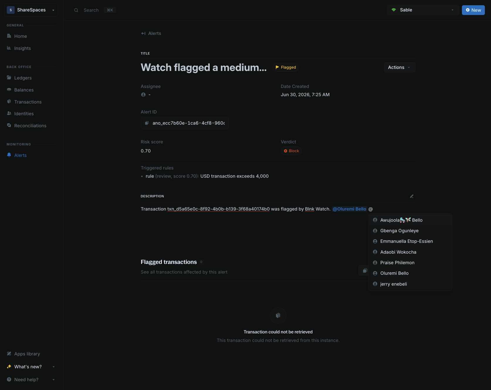 Alert description editor showing teammate mention suggestions