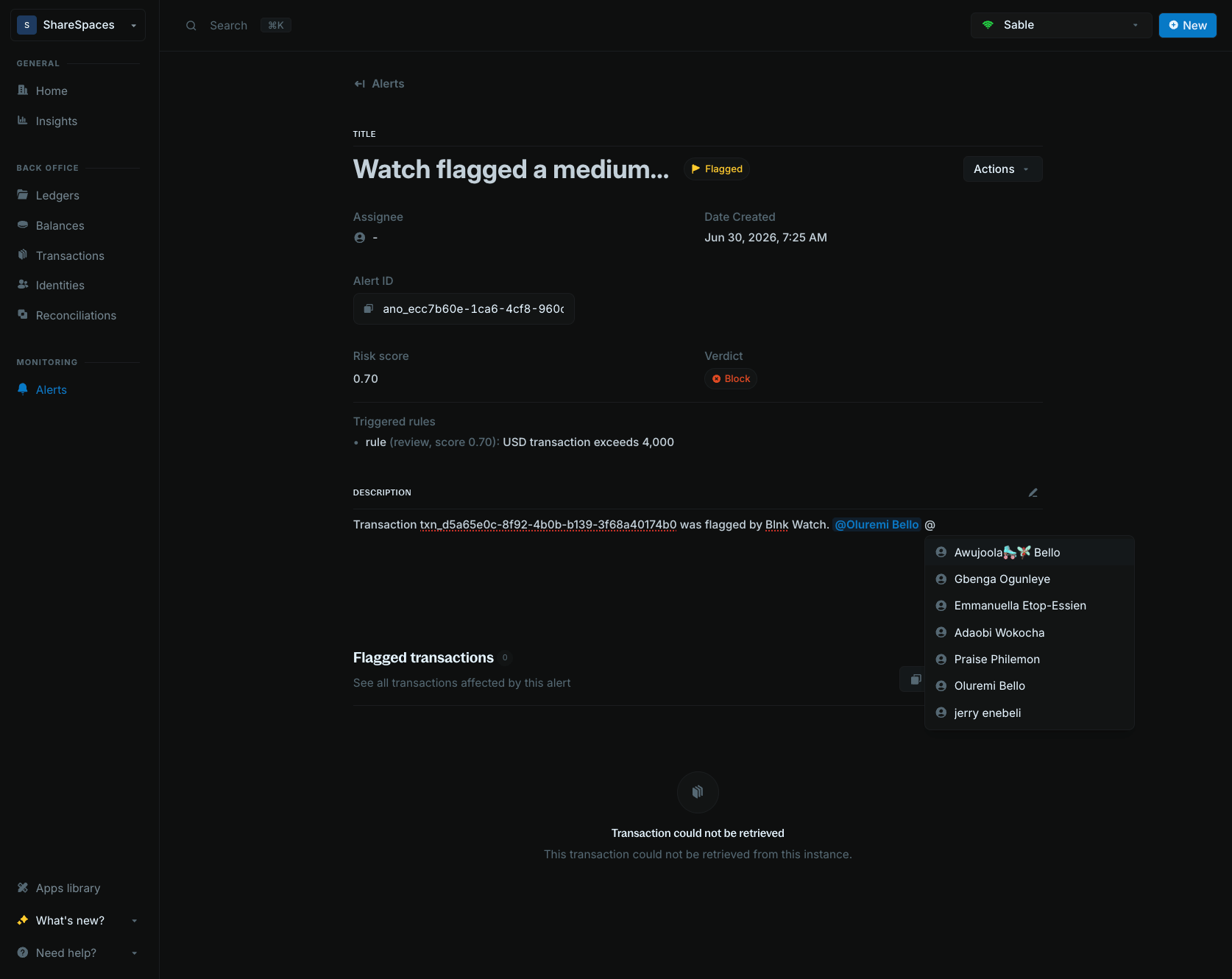 Alert description editor showing teammate mention suggestions