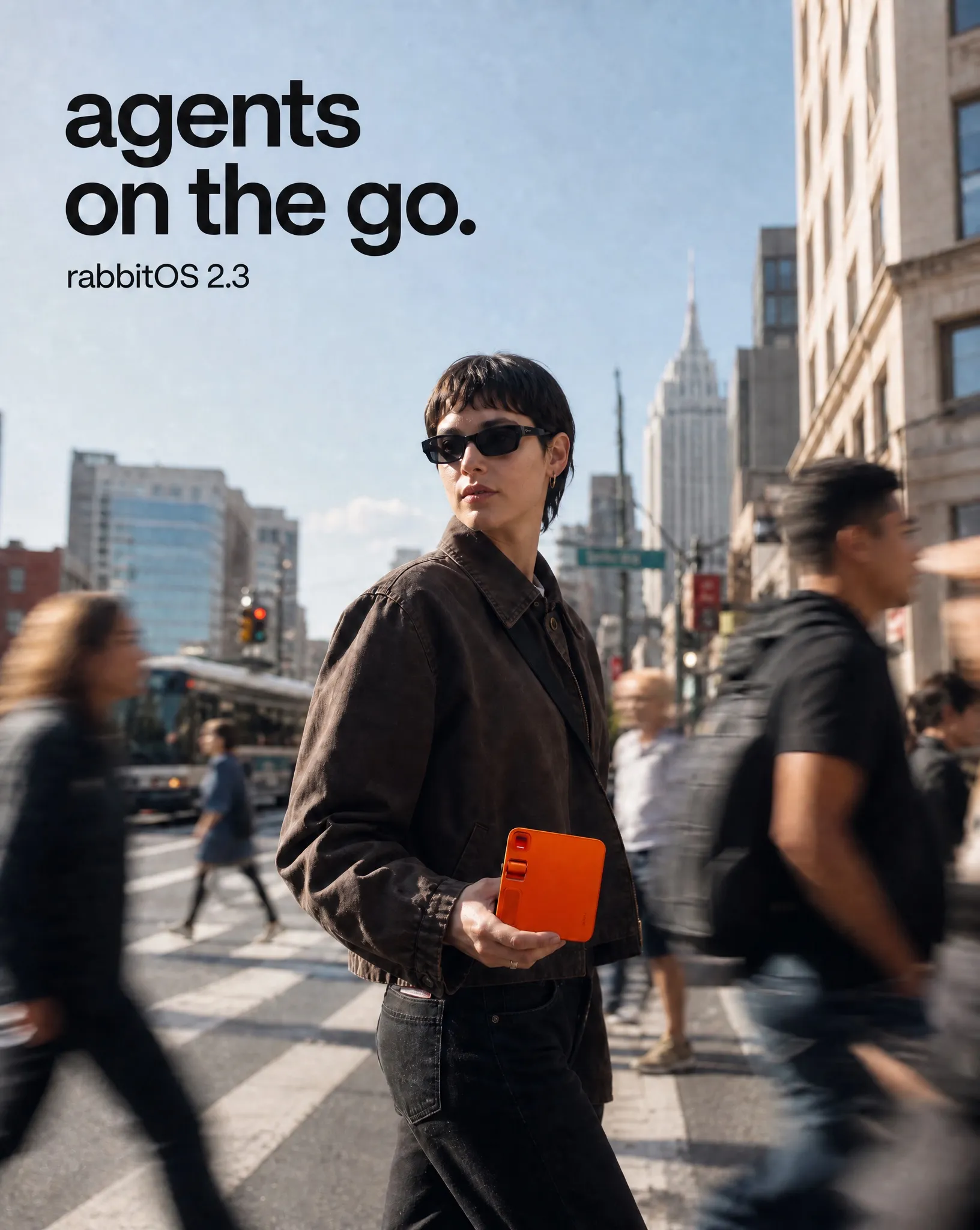 rabbit r1 campaign direction showing a person holding the orange device on a busy city street
