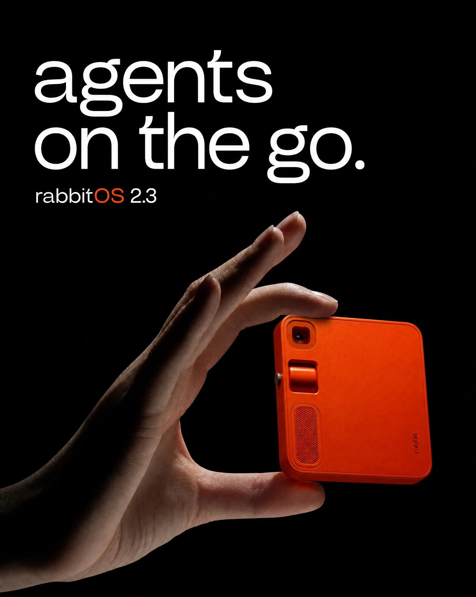 Product-led rabbit r1 campaign direction with a hand holding the orange device