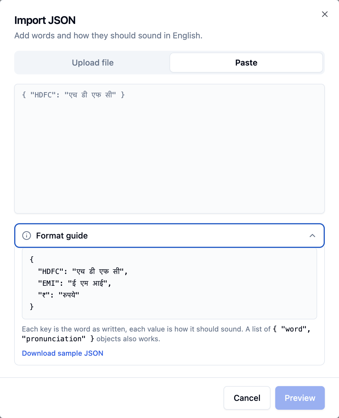 Import JSON dialog for English with Upload file and Paste tabs, a paste box, and an open Format guide showing a JSON object of words and how they sound