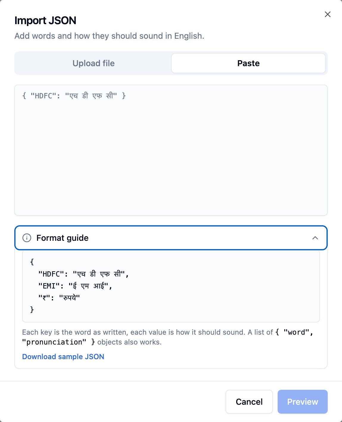 Import JSON dialog for English with Upload file and Paste tabs, a paste box, and an open Format guide showing a JSON object of words and how they sound