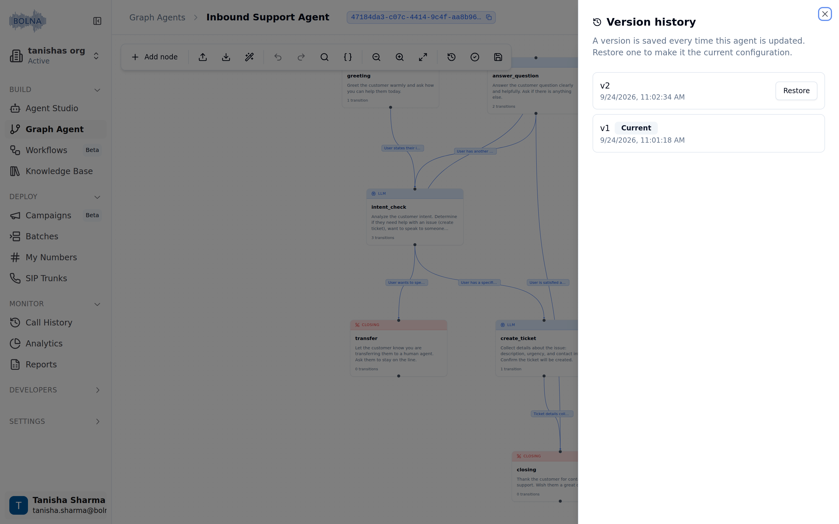 Version history sheet open over the graph canvas, listing v2 with a Restore button and v1 tagged Current, each with its save timestamp