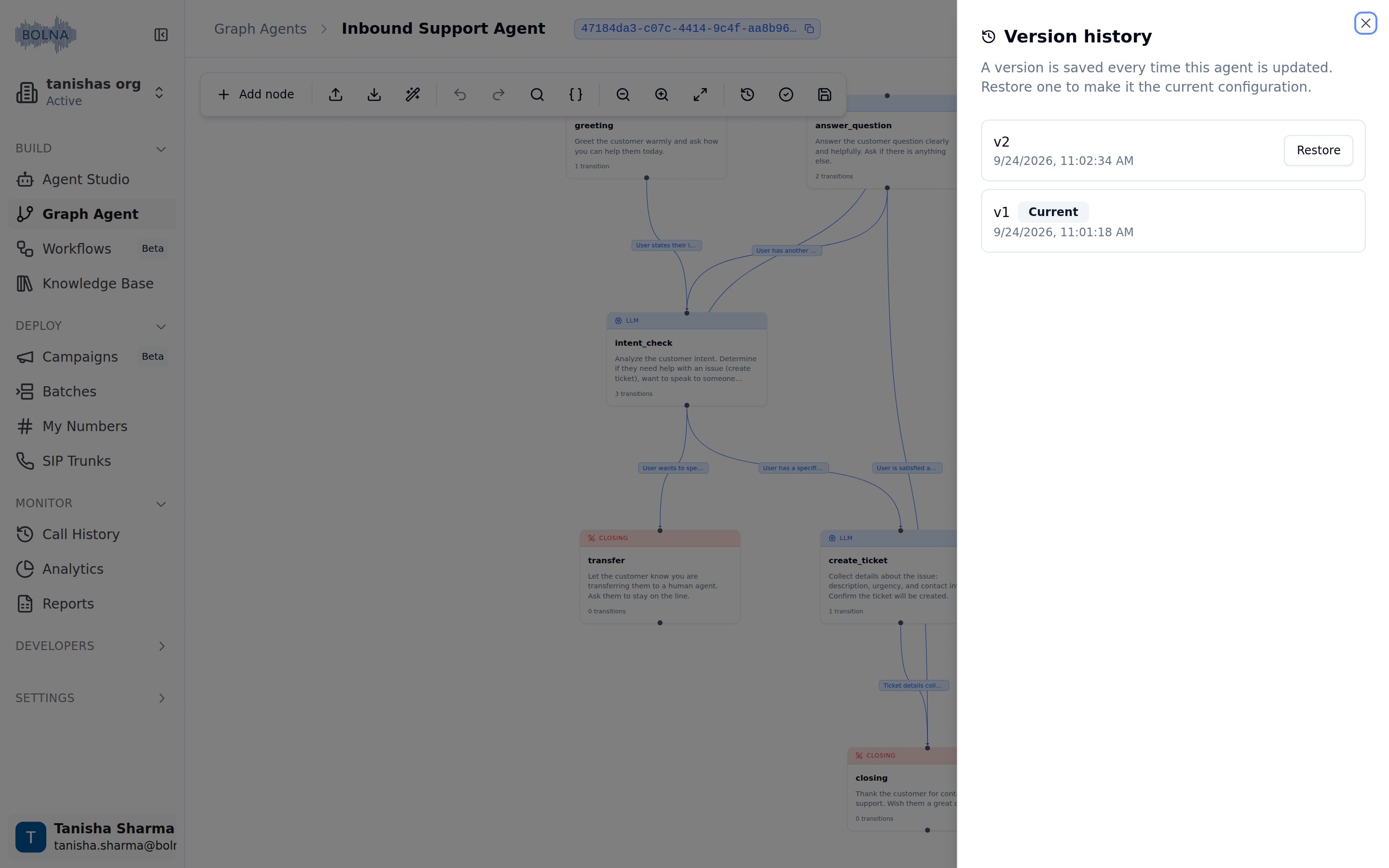 Version history sheet open over the graph canvas, listing v2 with a Restore button and v1 tagged Current, each with its save timestamp