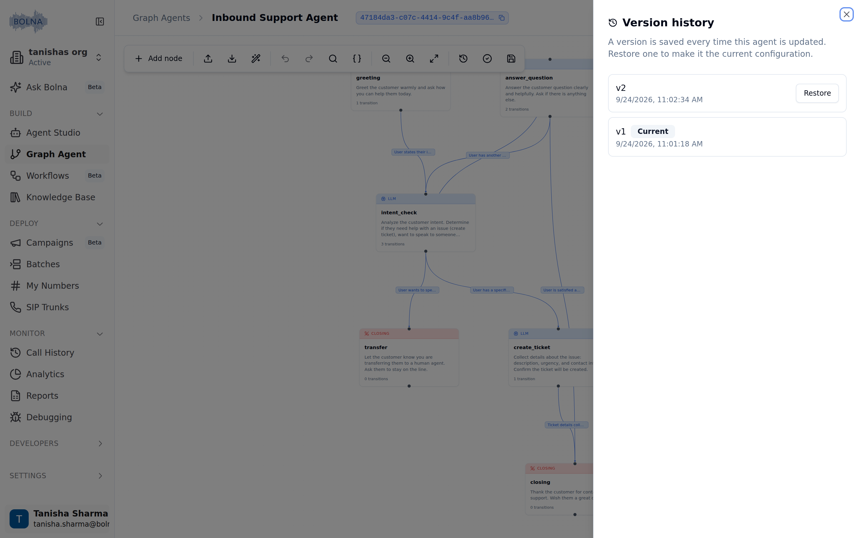Version history sheet open over the graph canvas, listing v2 with a Restore button and v1 tagged Current, each with its save timestamp