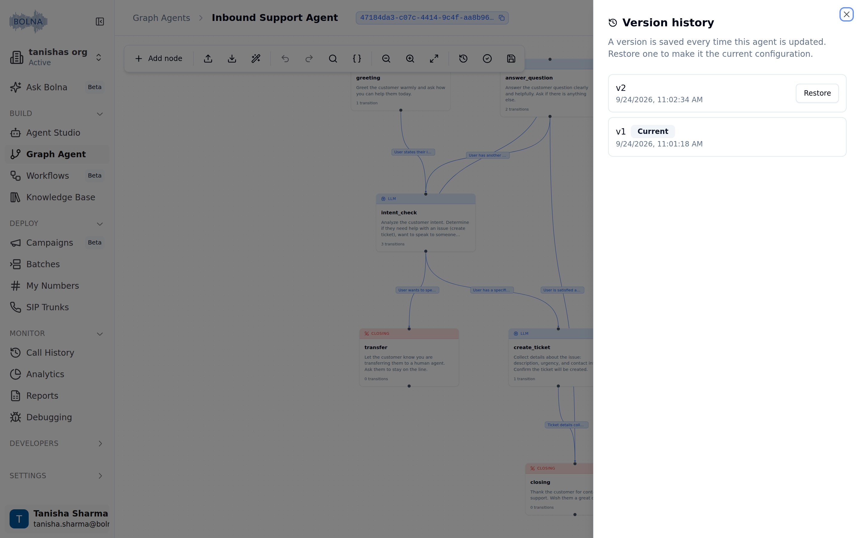 Version history sheet open over the graph canvas, listing v2 with a Restore button and v1 tagged Current, each with its save timestamp